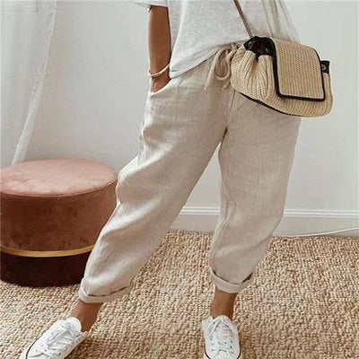 Pantalon décontracté uni pour femme en coton et lin beige, style minimaliste et confortable.