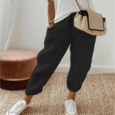 Pantalon décontracté uni noir pour femme, style léger et fluide en coton et lin, look naturel et confortable.